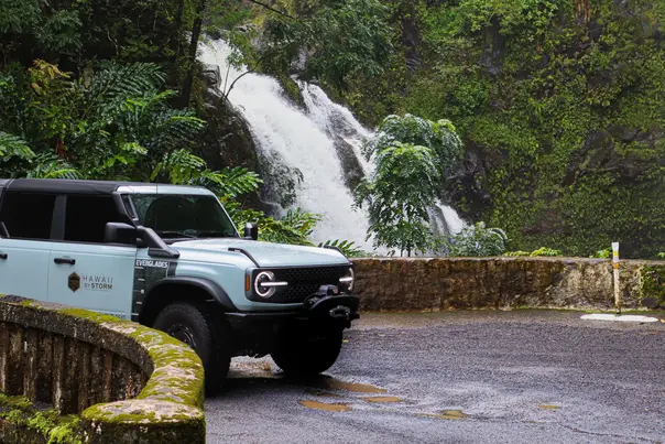 Hawaii By Storm Bronco beside a rainforest waterfall on the Hana and Back tour