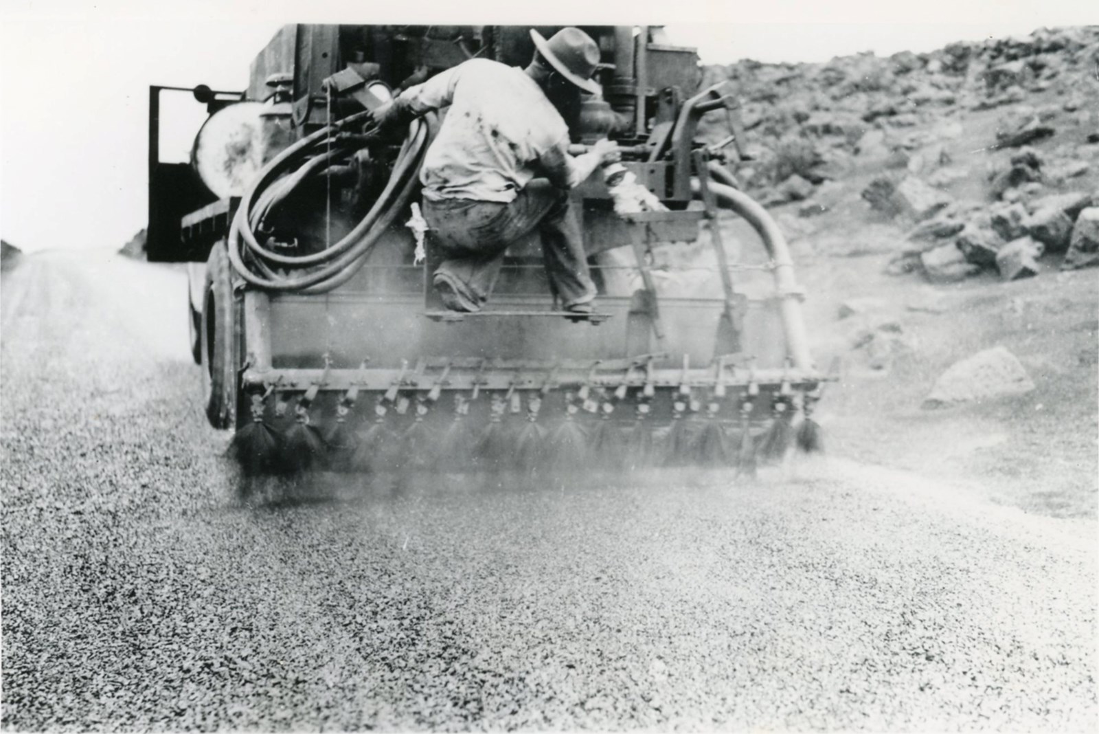 Road crews and heavy equipment surfacing the Haleakalā Highway in 1935