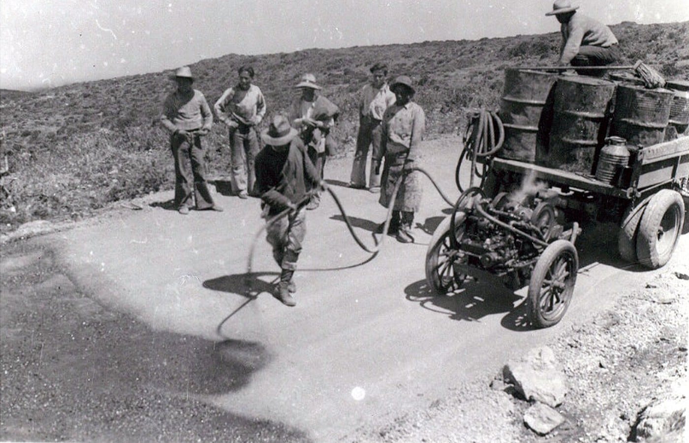 Road crew applying asphalt to Haleakalā Highway in 1934
