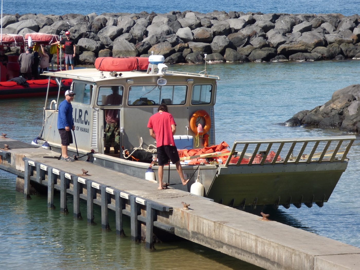 A Kahoʻolawe Island Reserve Commission workboat tied to a dock inside Kīhei Boat Ramp