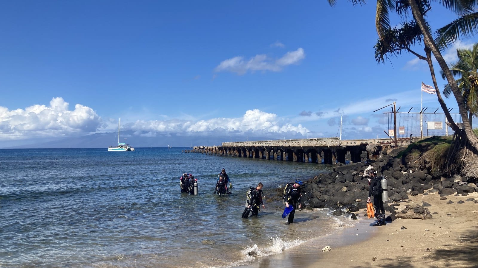 The historic Māla Wharf extending from the West Maui shoreline beside the active public boat ramp