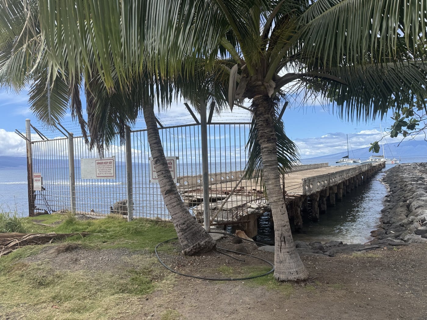 Close view of the broken concrete deck and pilings of the historic Māla Wharf