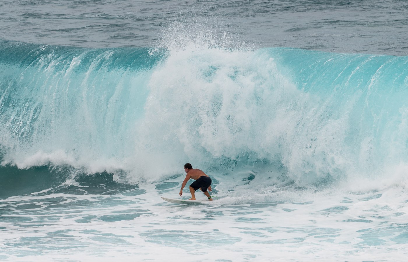 Surfer riding a wave at Hoʻokipa Beach Park on Maui