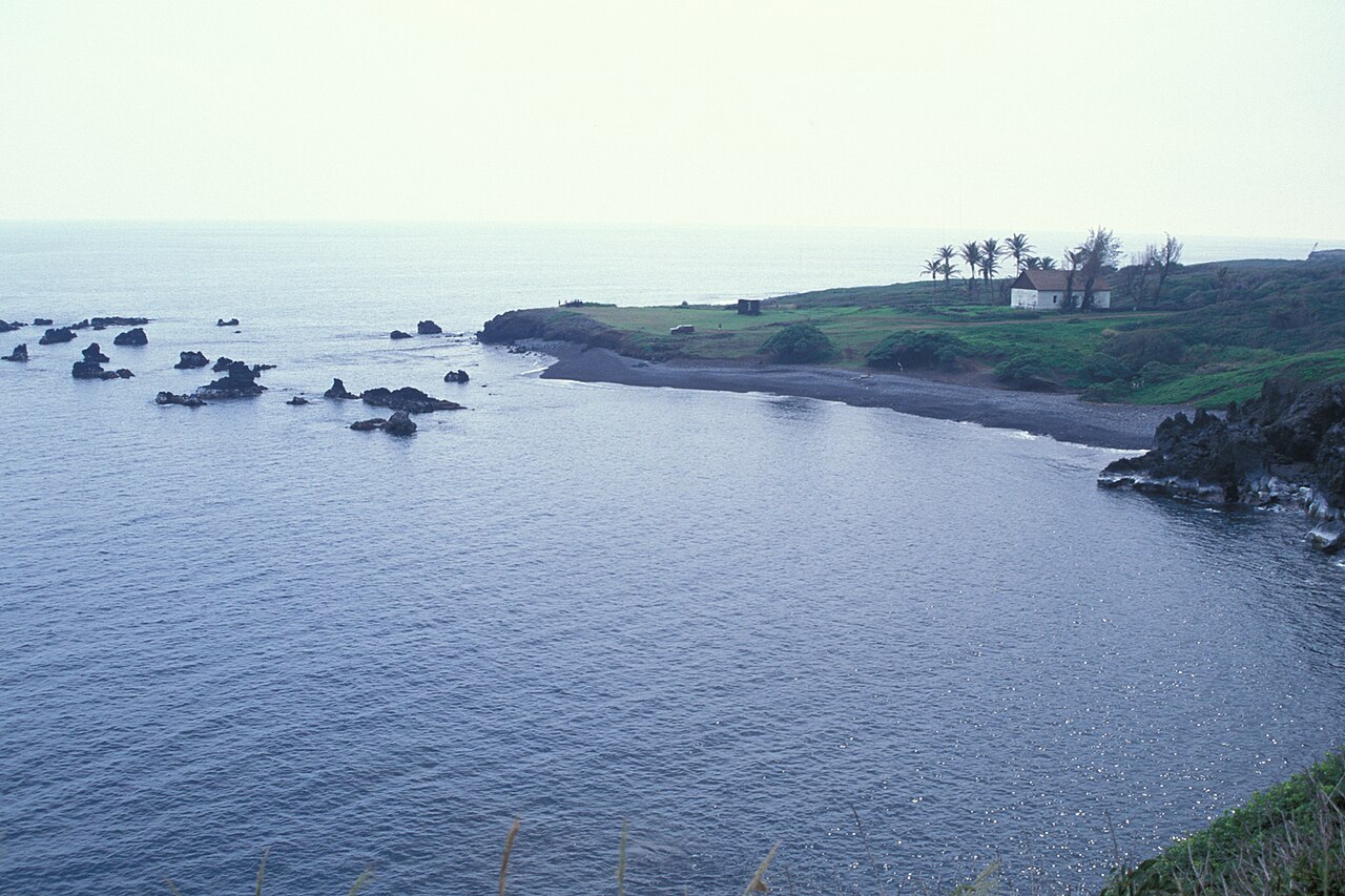 Hui Aloha Church framed by coconut palms at Kaupō, Maui